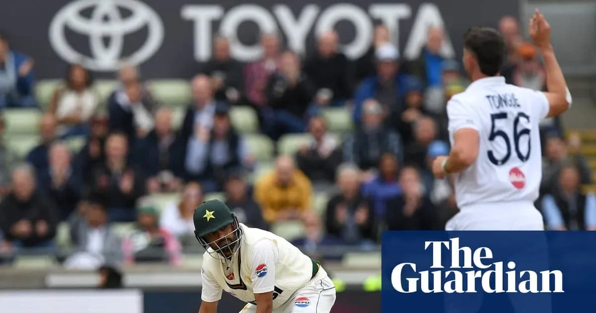Cricketer in action during match with spectators in background