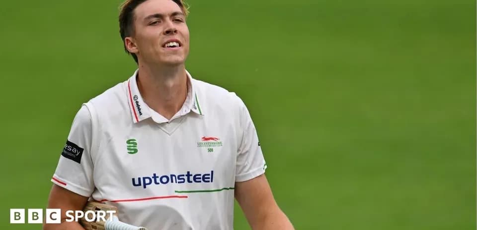 Cricketer walking off the field after batting