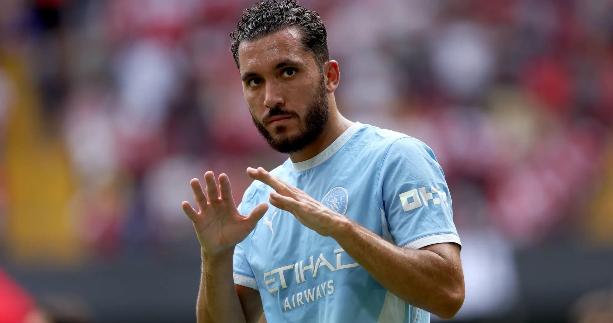 Player gesturing during a match warm-up