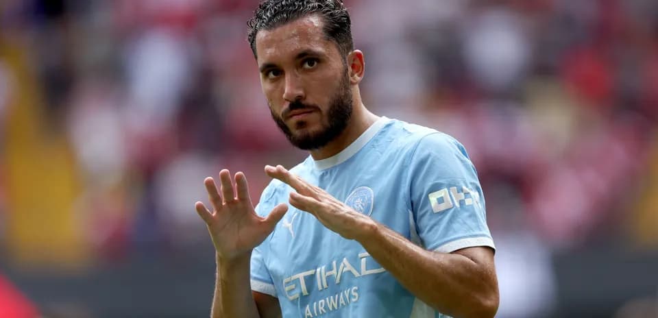 Player gesturing during a match warm-up
