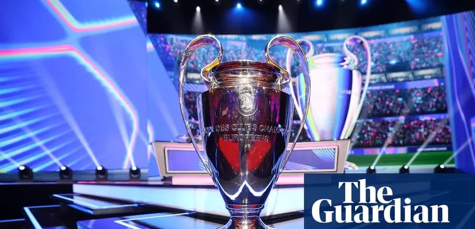 UEFA Champions League trophy on stage with lights