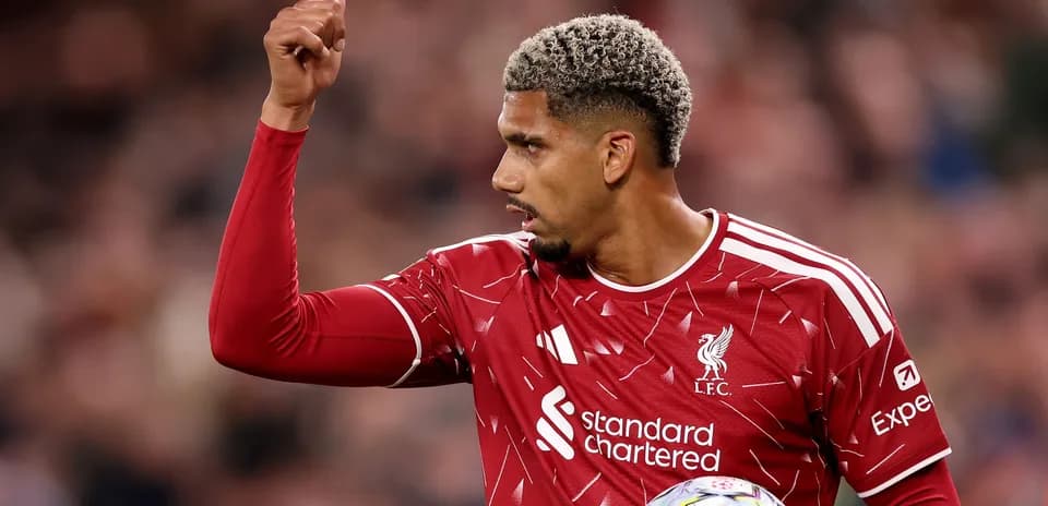 Liverpool player signaling during a match