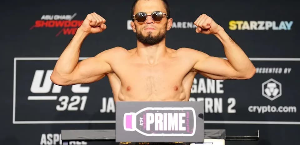 Fighter posing at weigh-in event for UFC 321
