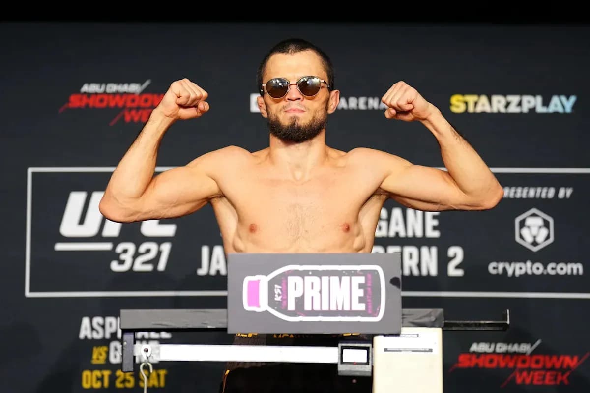 Fighter posing at weigh-in event for UFC 321