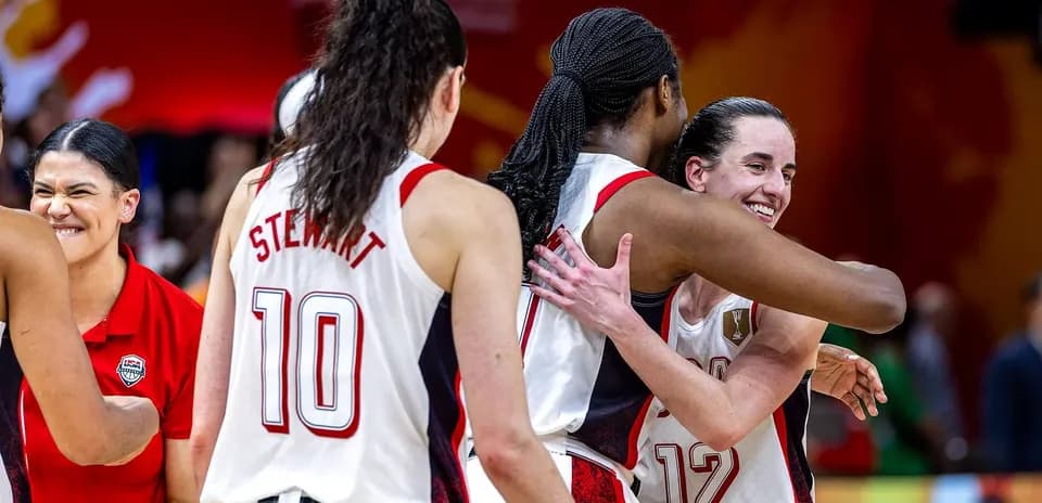 Players celebrating after a basketball game victory
