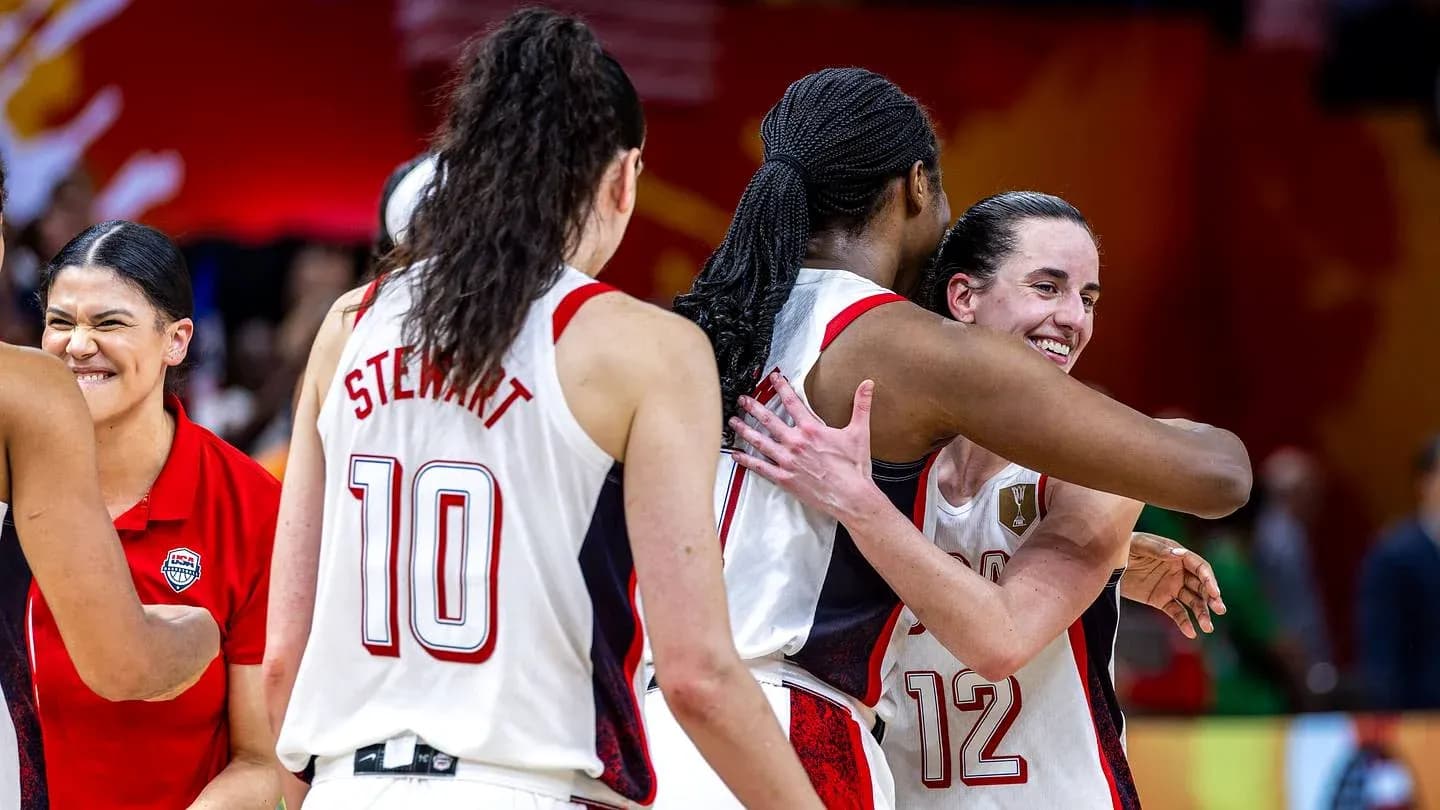 Players celebrating after a basketball game victory