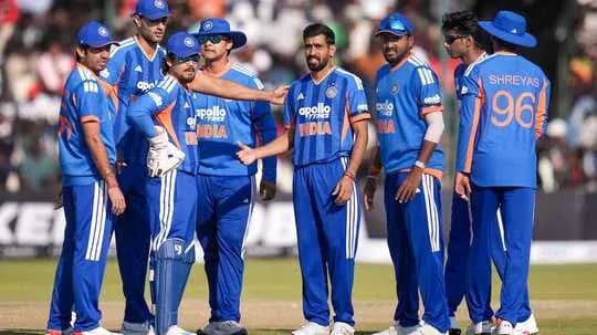 Indian cricket team discussing strategy on field