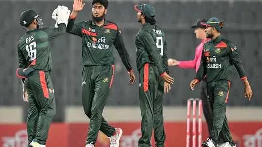 Bangladesh cricket team celebrating a wicket on field