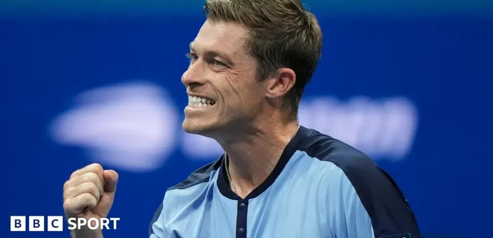 Tennis player celebrating a victory on court