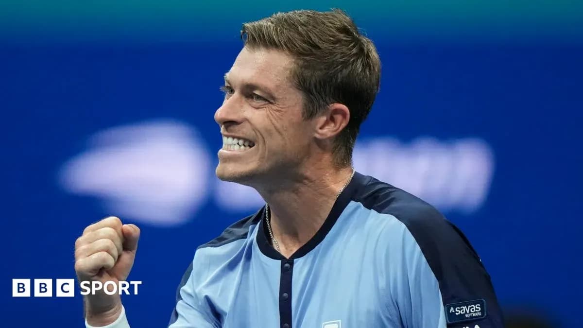 Tennis player celebrating a victory on court