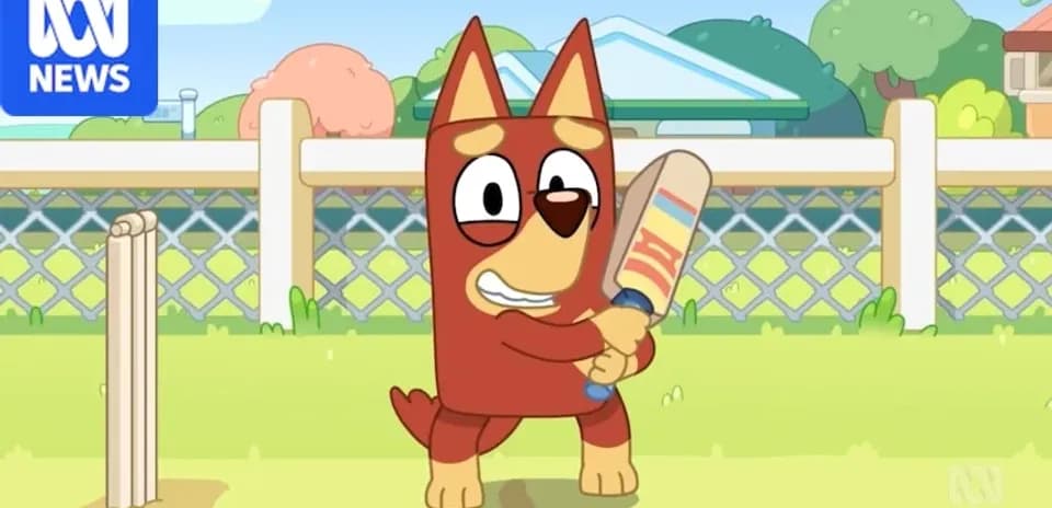 Animated dog character holding a cricket bat