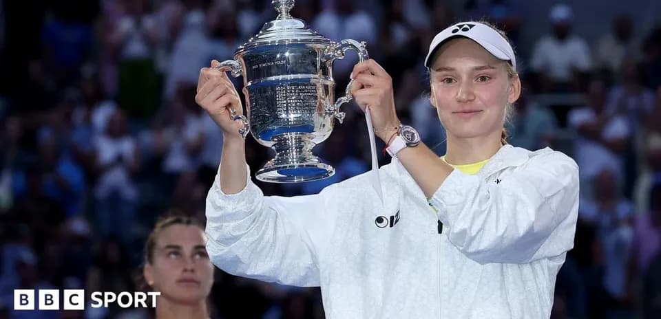 Player holding trophy after winning the match