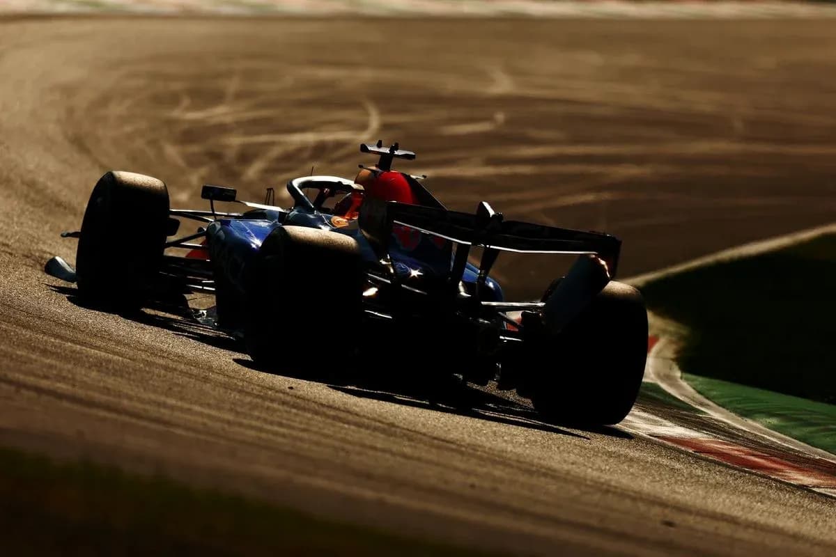 Formula 1 car navigating a curve on track
