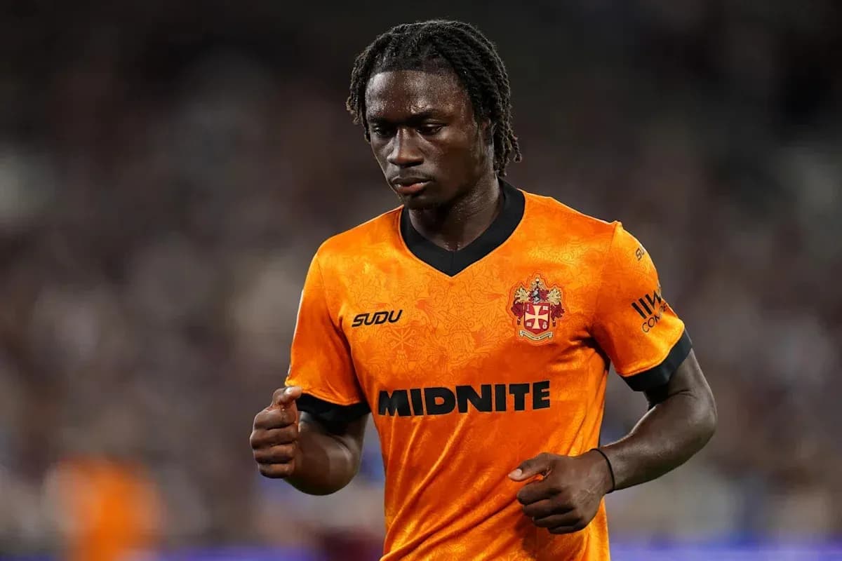 Player in orange jersey walking on the field