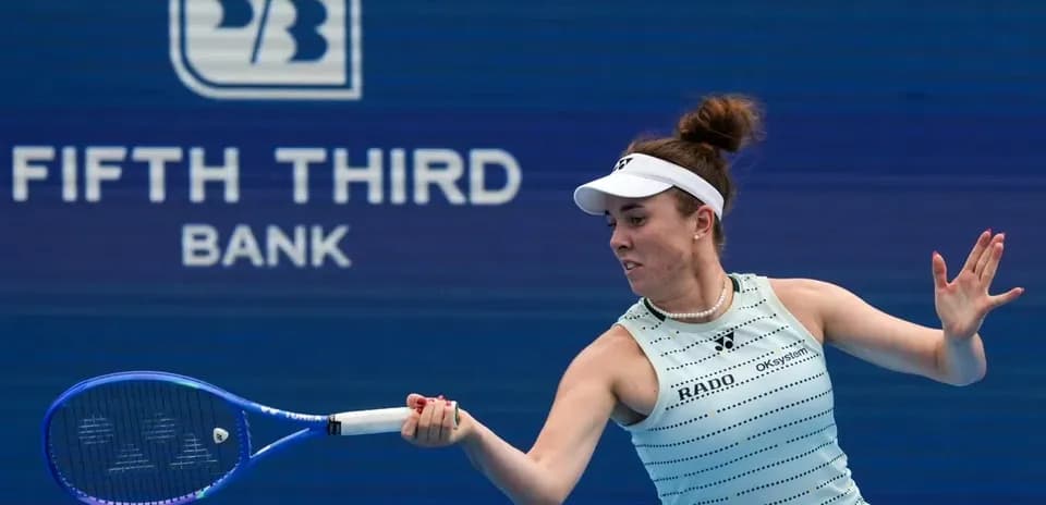 Tennis player hitting a forehand shot during match