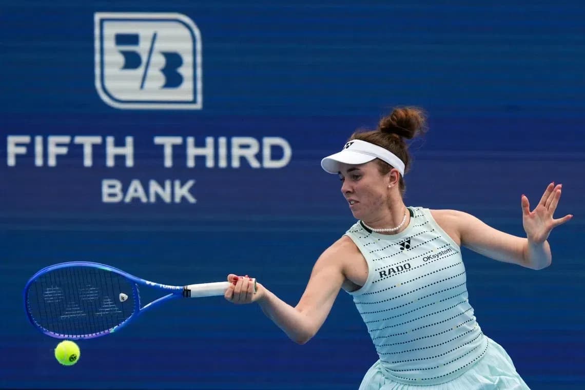 Tennis player hitting a forehand shot during match