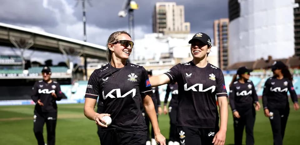 Two cricketers celebrating after a match at the stadium