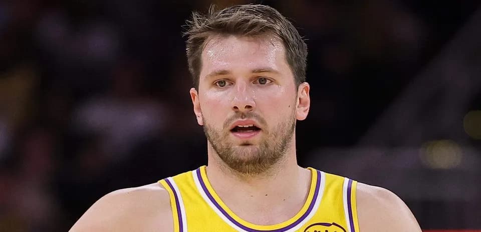 Player in yellow jersey during basketball game