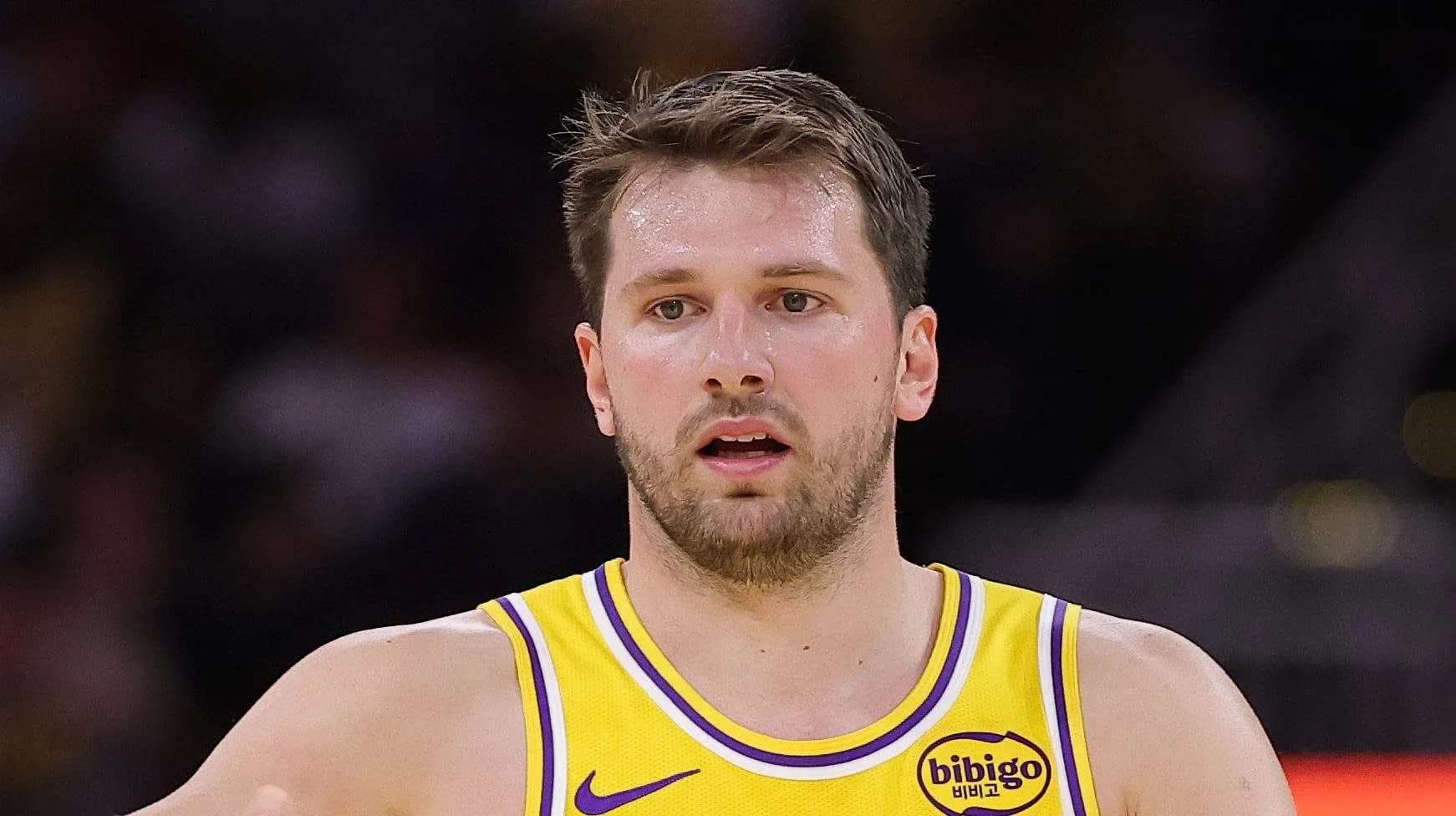 Player in yellow jersey during basketball game