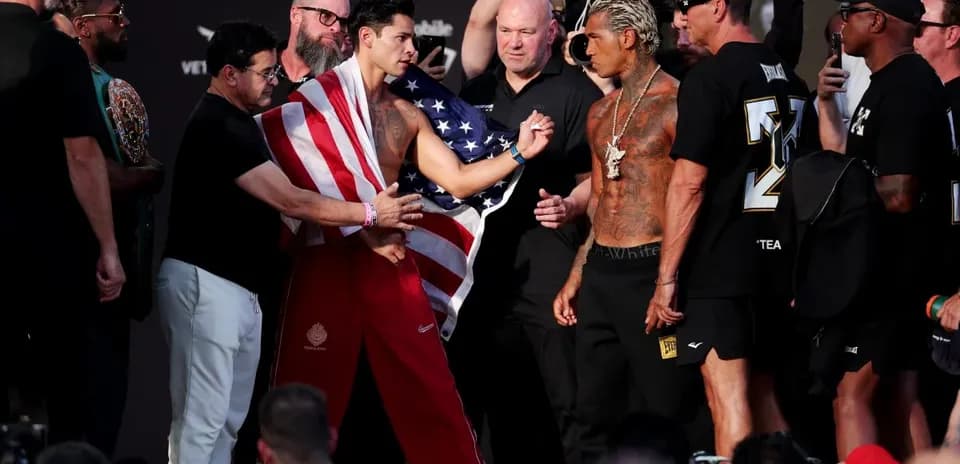 Two fighters facing off at weigh-in event