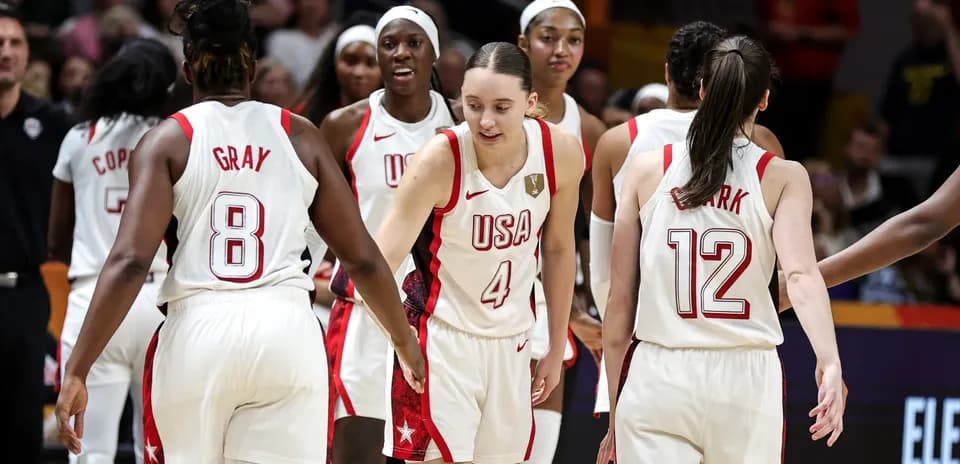 USA women's basketball team celebrating on court