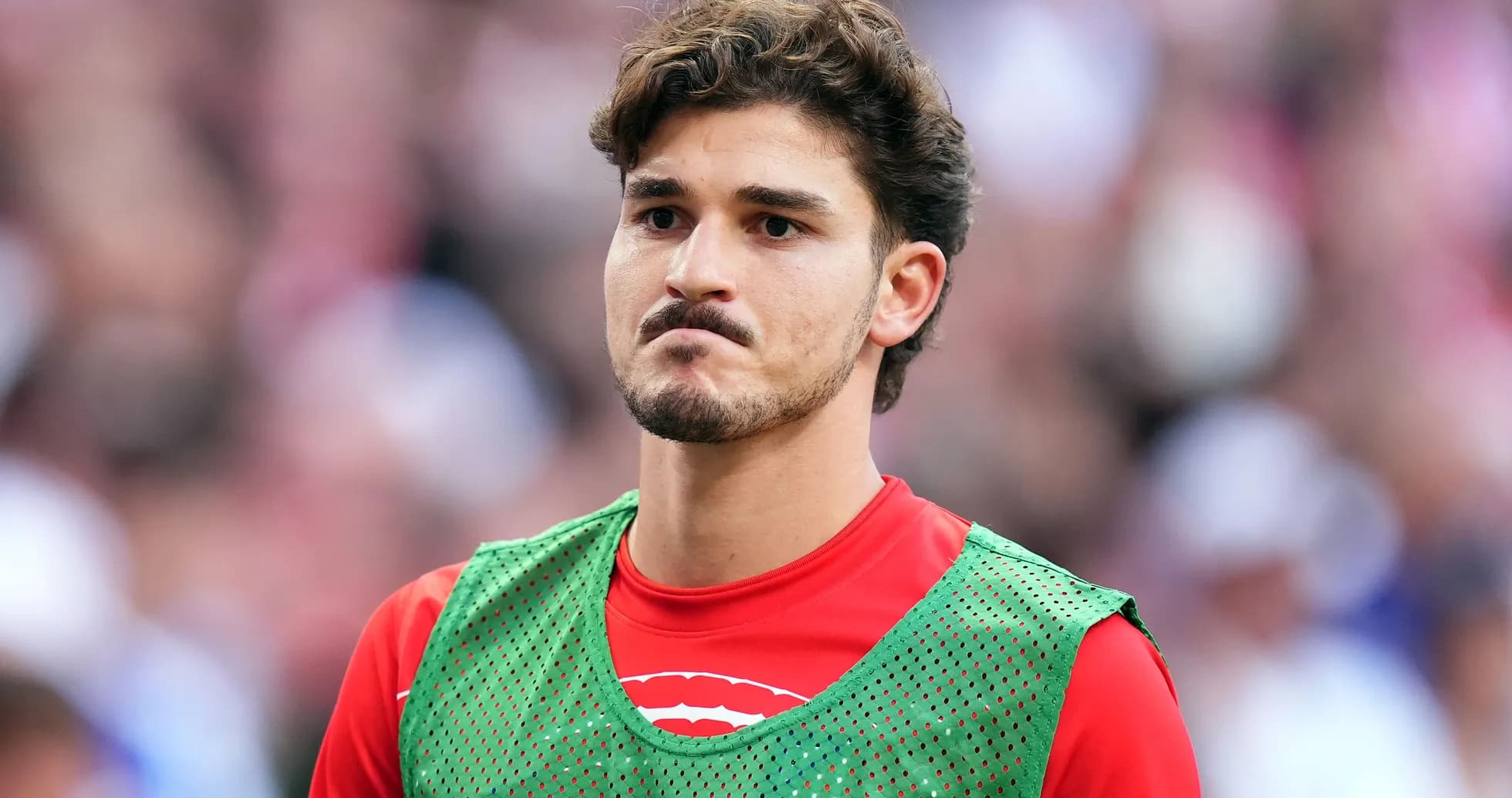 Player in training gear on the sidelines