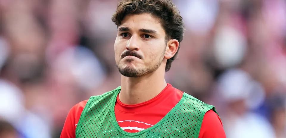 Player in training gear on the sidelines
