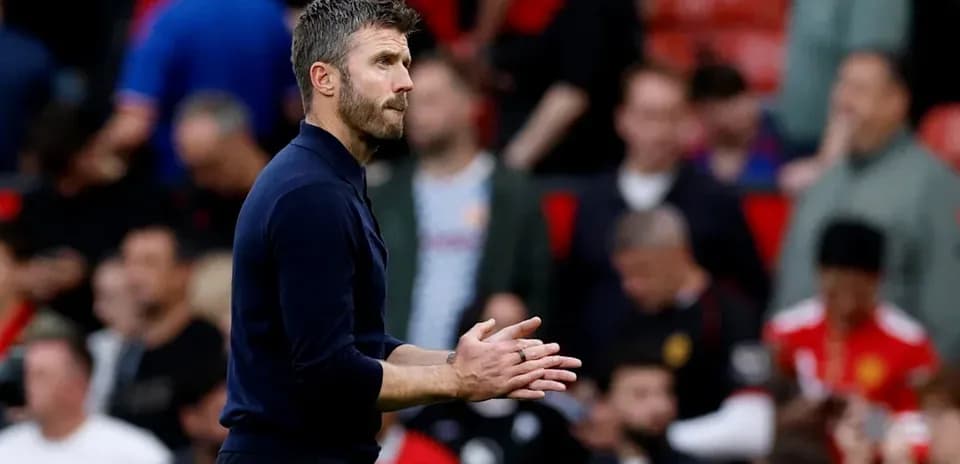 Coach gesturing during a match at Old Trafford