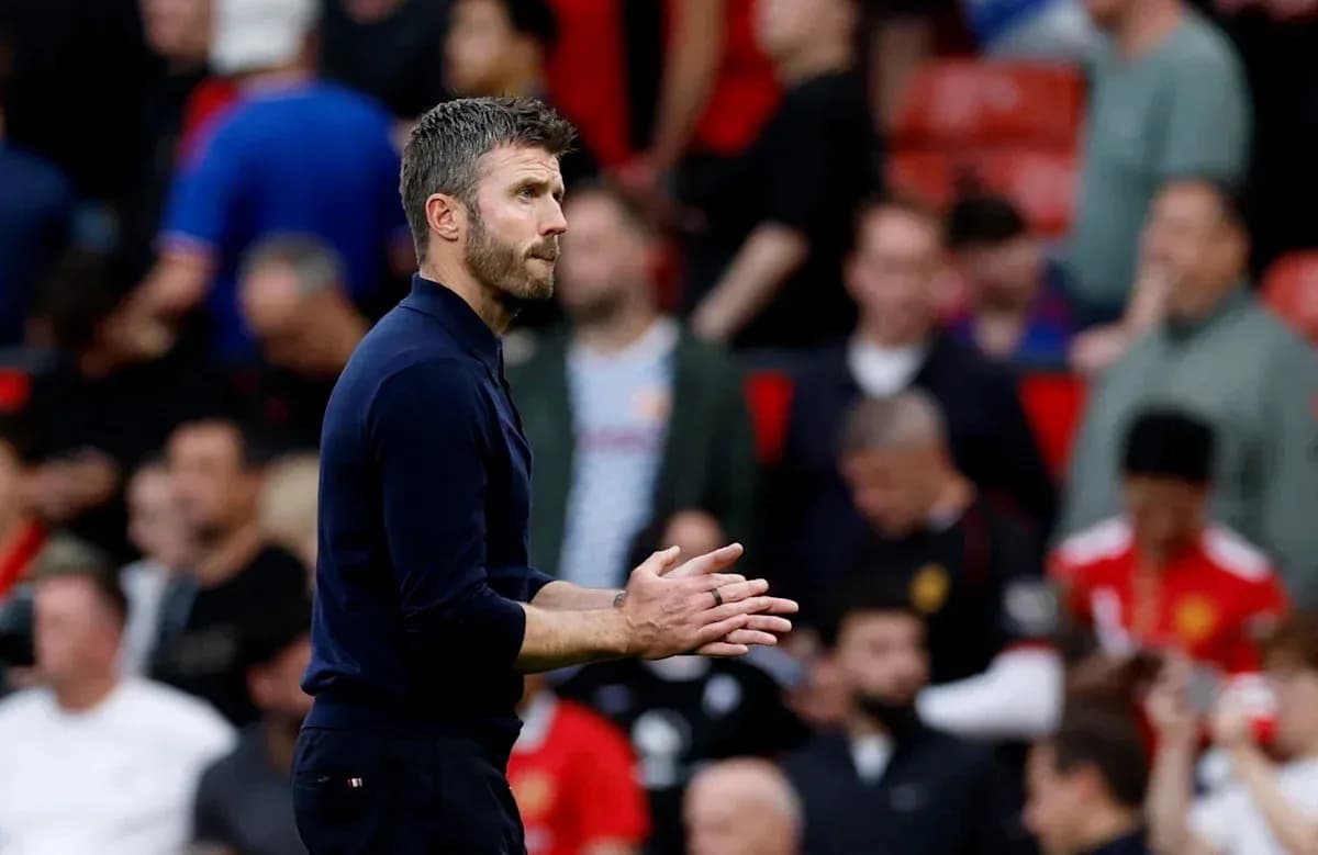 Coach gesturing during a match at Old Trafford