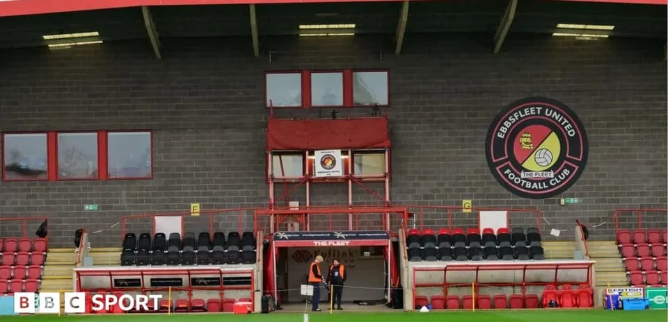 Ebbsfleet United stadium with staff near entrance