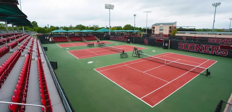 Tennis courts at Oklahoma University with empty bleachers