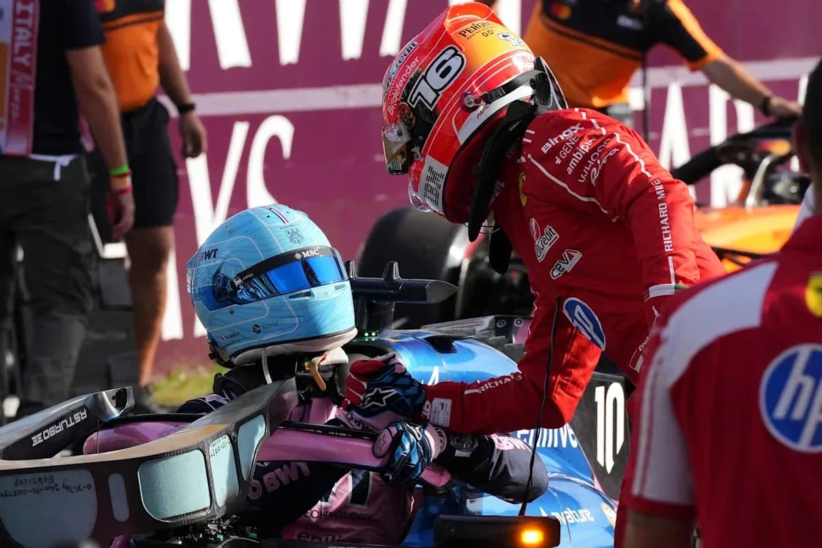 Drivers interacting after a race incident in pit area