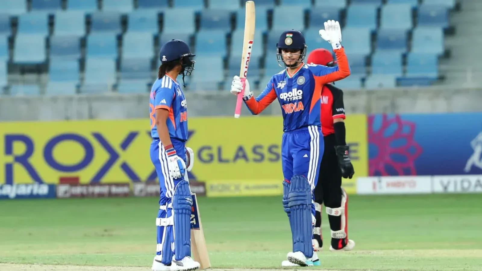 Batsman celebrating after scoring during cricket match