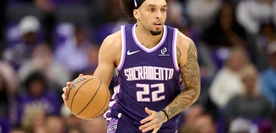 Player dribbling basketball during game for Sacramento