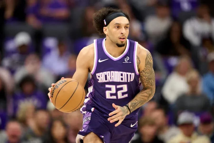 Player dribbling basketball during game for Sacramento