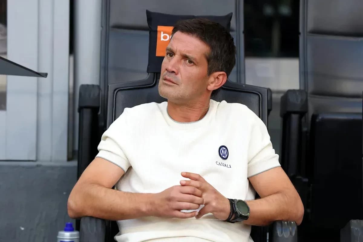 Coach seated on the bench during a match