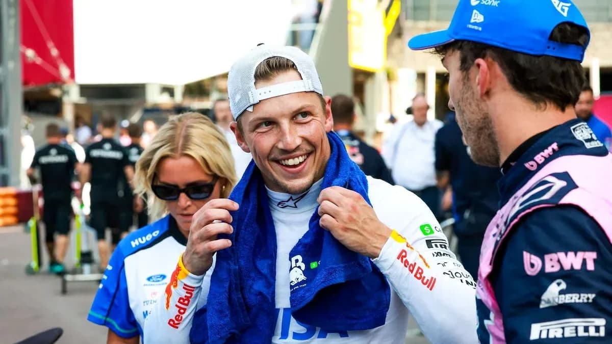Two drivers chatting in paddock after race