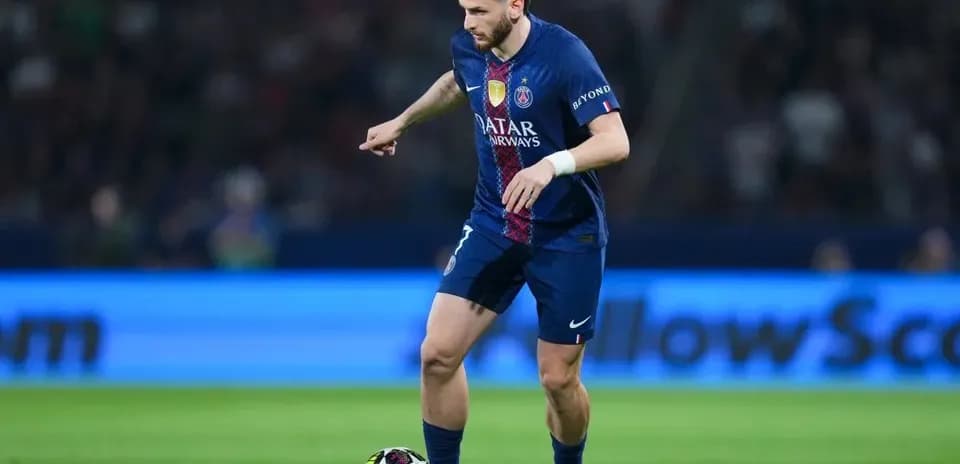 Player dribbling ball during a football match