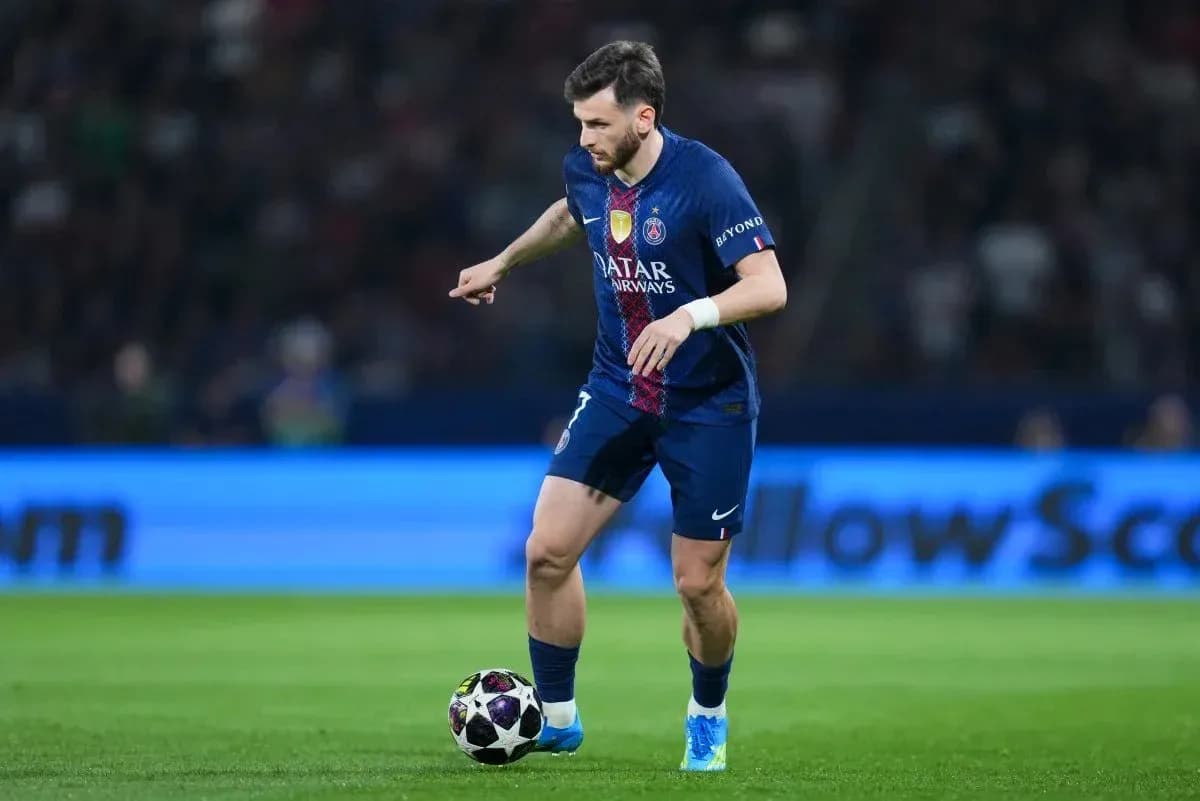 Player dribbling ball during a football match