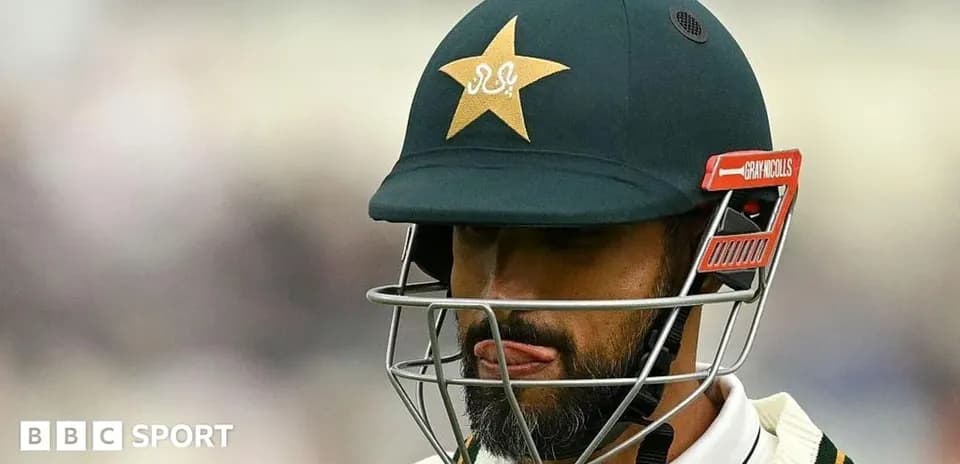 Cricketer wearing helmet during a match