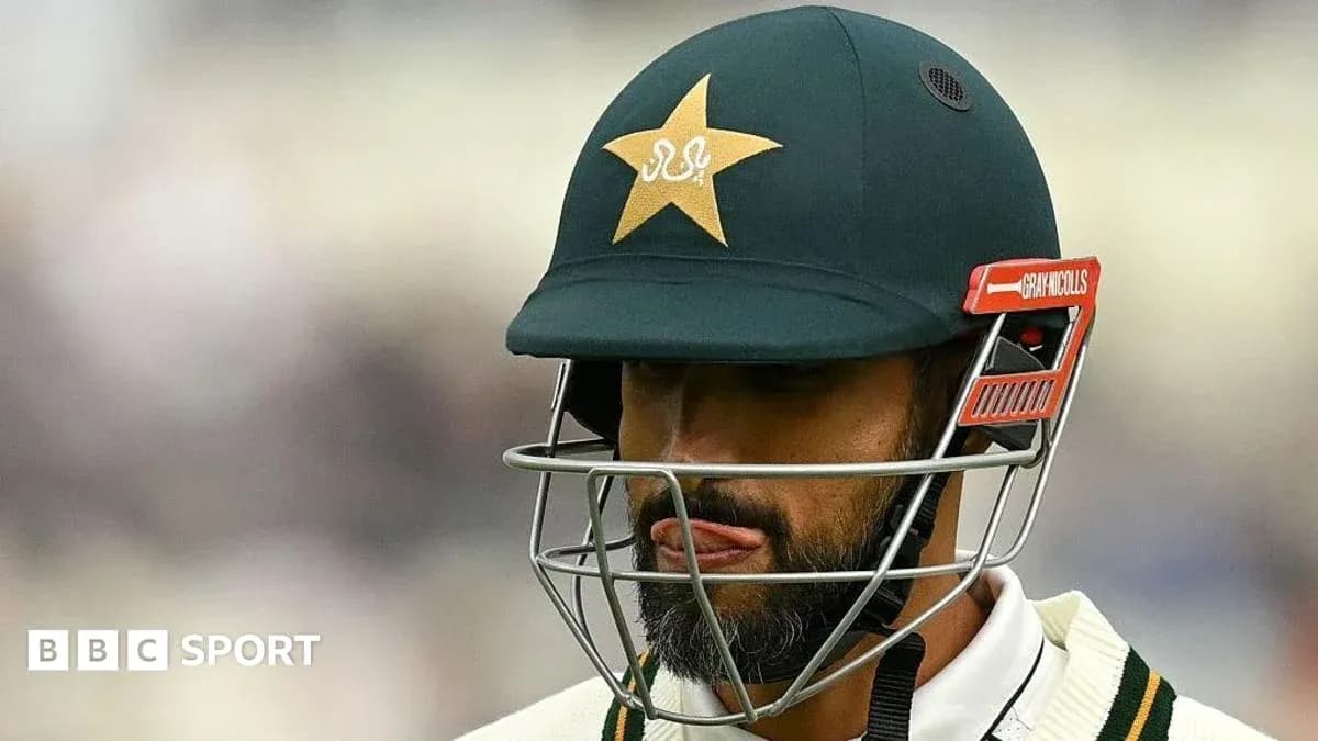 Cricketer wearing helmet during a match
