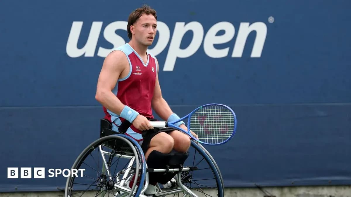 Wheelchair tennis player preparing to serve at US Open