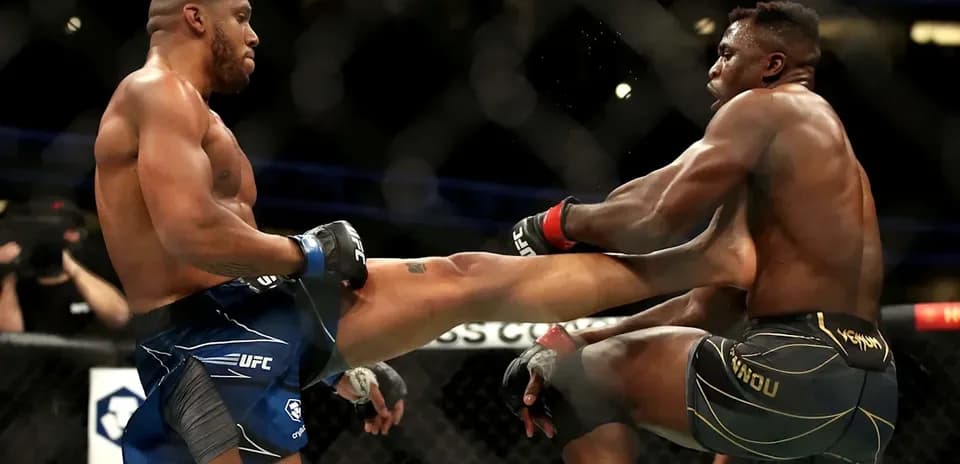 Two fighters exchanging kicks in the octagon