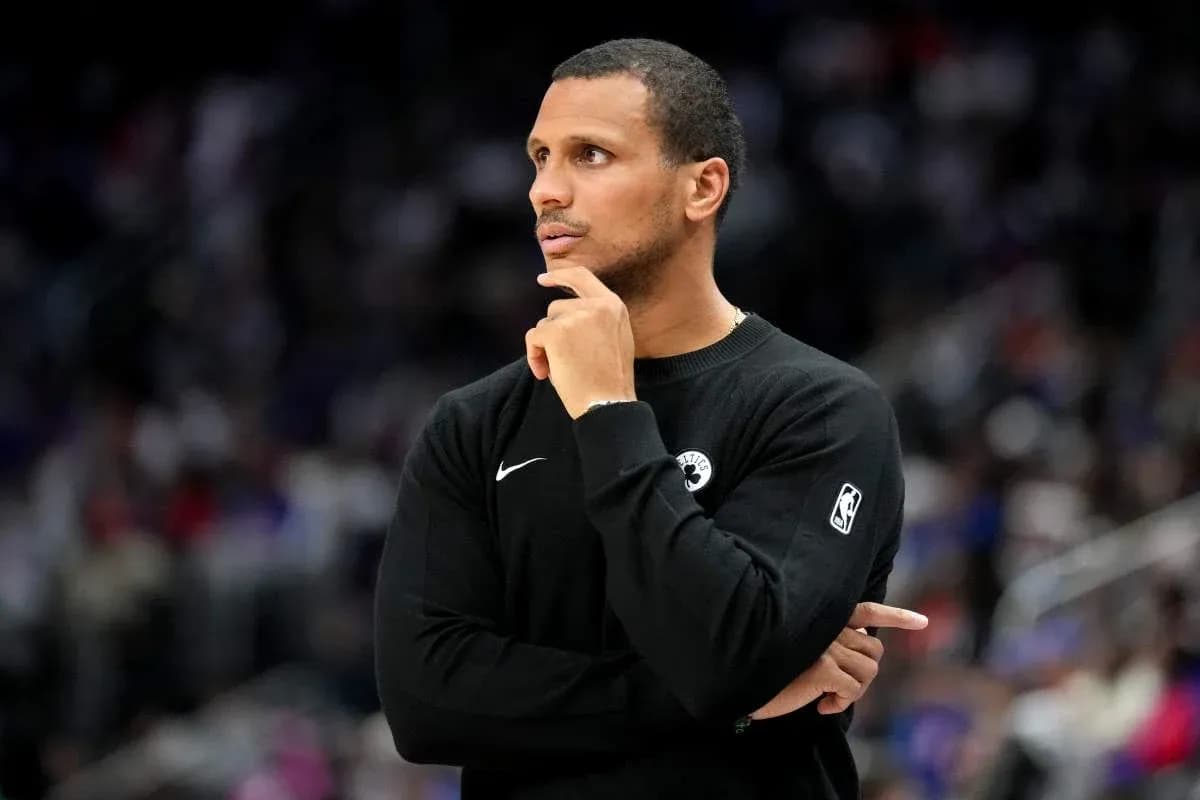 Coach observing game with hand on chin