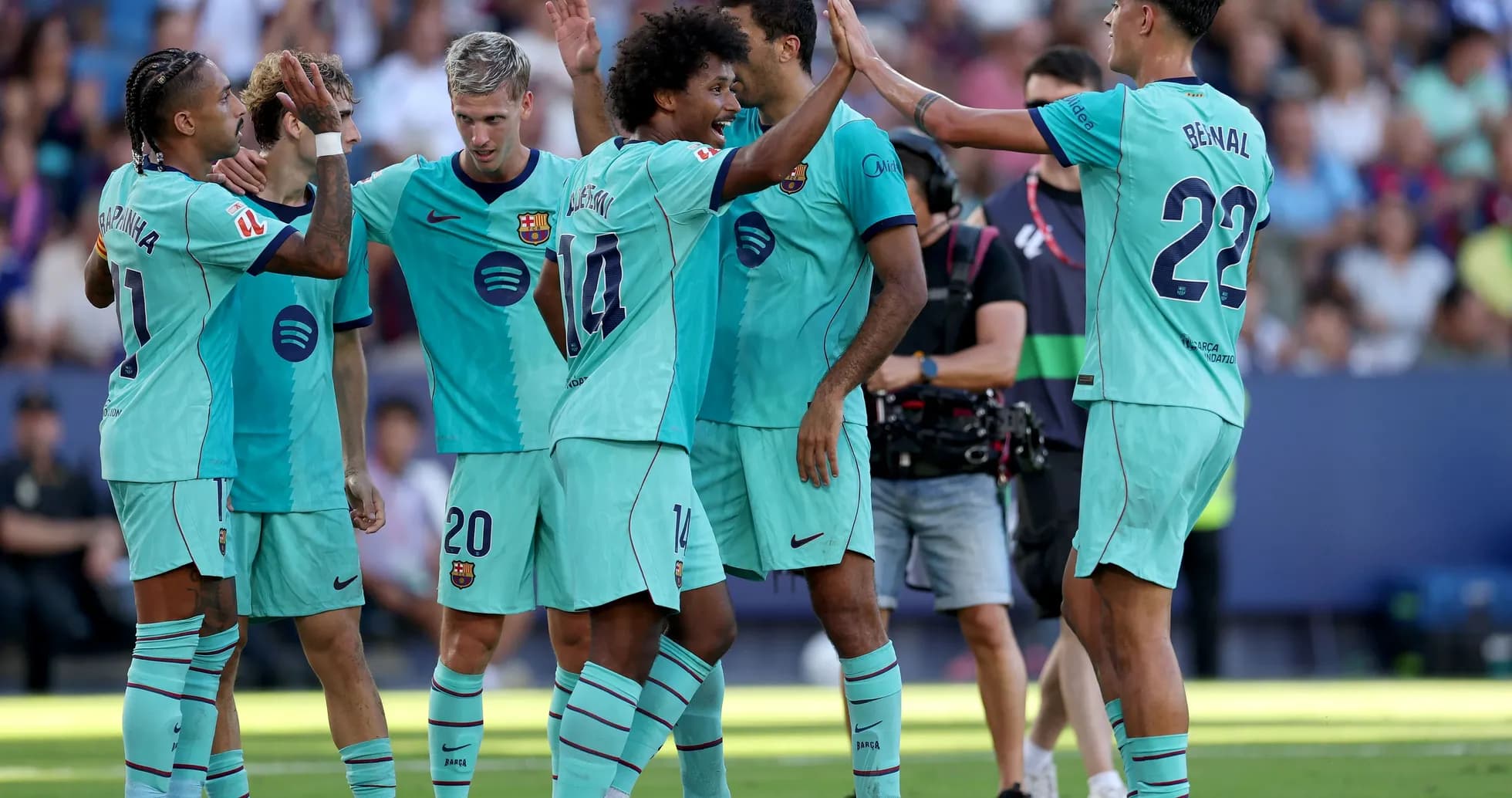 Barcelona players celebrating a goal on the field