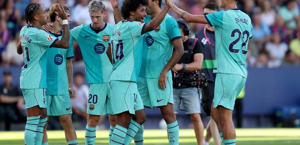 Barcelona players celebrating a goal on the field
