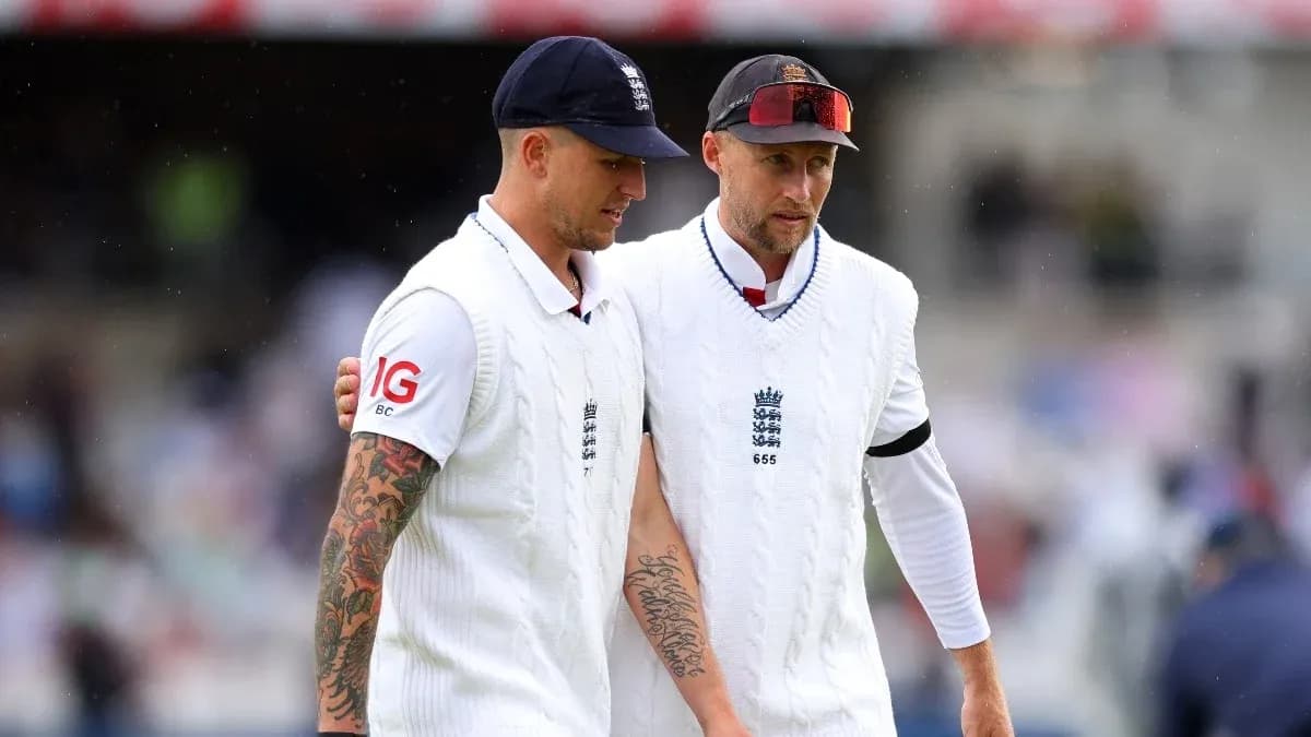 Two cricketers walking off the field in whites