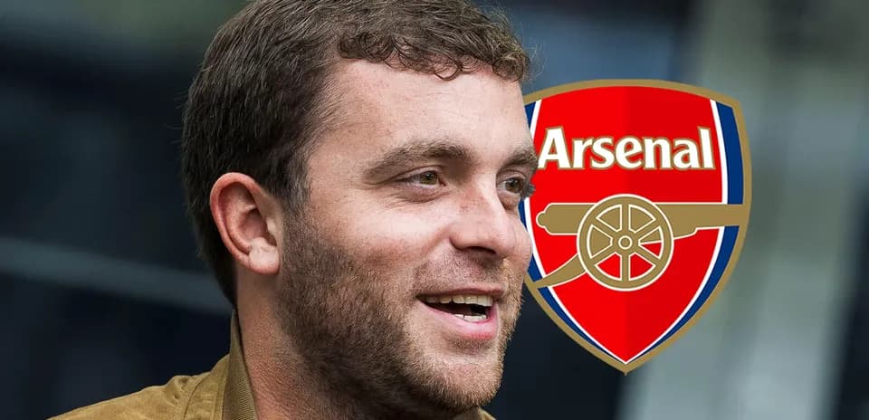 Person smiling next to Arsenal logo