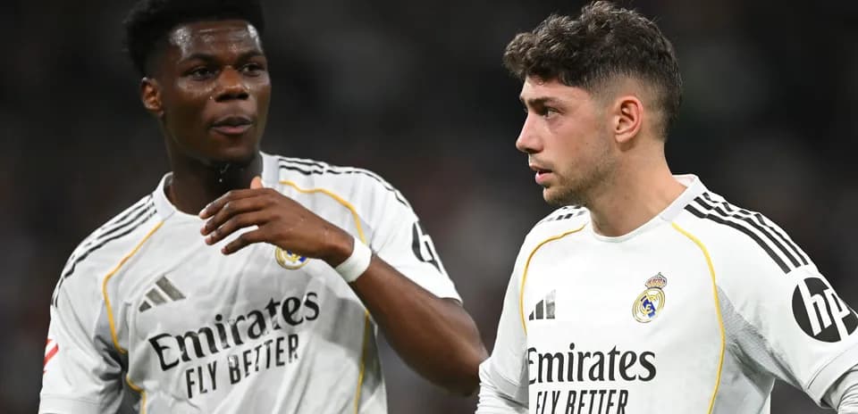 Two Real Madrid players discussing on the pitch