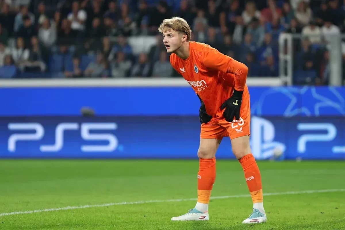 Goalkeeper in orange kit preparing during match